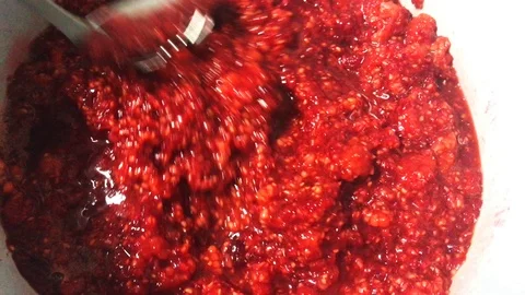 Cooking red raspberry jam in a pan. Stock Footage 111814922