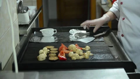 Cooking in a restaurant kitchen as a chef Stock Footage 326958585