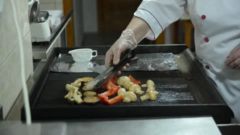 Cooking in a restaurant kitchen as a chef Stock Footage 326958608