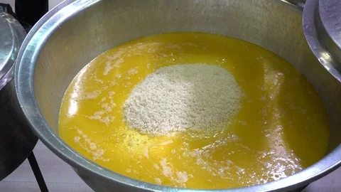 Cooking rice in big cauldron Stock Footage 120992230