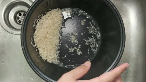 Cooking rice at home Stock Footage 135738806