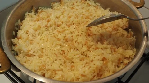 Cooking rice in the kitchen for dinner Stock Footage 141466444