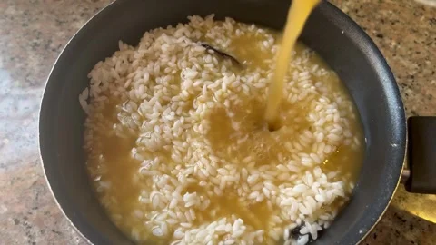Cooking Rice in a Pot for Maqluba Stock Footage 345321416