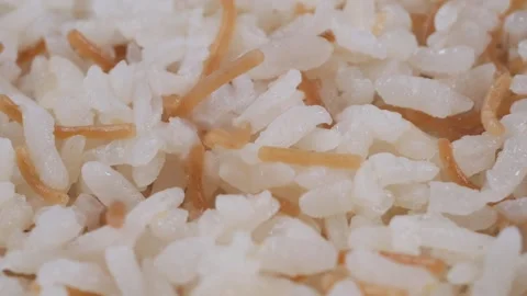 Cooking rice with vermicelli in a simple method Stock Footage 333943518