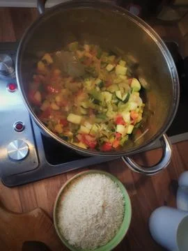 Cooking Risotto Preparation with Rice in a Pot Photos