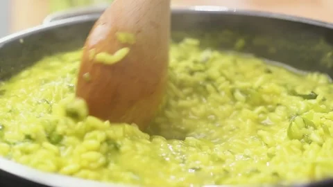 Cooking risotto with vegetables in the pan. Video stock 150828599