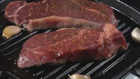Cooking roast beef. The meat in a frying pan Stock Footage 72920919