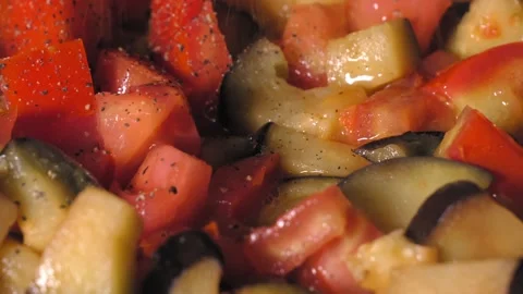 Cooking roasted vegetables. Chef Adds Seasoning to Steaming Hot Skillet. Vídeo Stock 250773047
