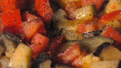 Cooking roasted vegetables. Chef Adds Seasoning to Steaming Hot Skillet. 스톡 동영상 250775585