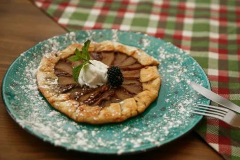 Cooking rustic pie, galette with pears and cinnamon. Top view Stock Photos