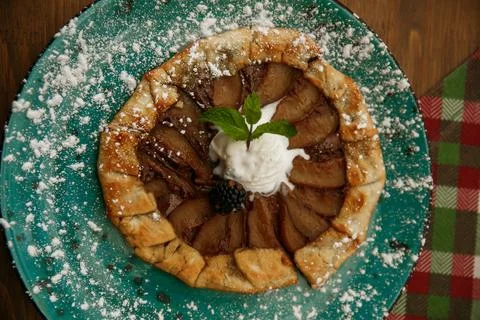 Cooking rustic pie, galette with pears and cinnamon. Top view Stock Photos