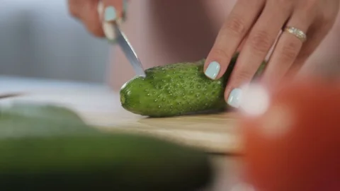 Cooking a salad with cucumber Stock Footage 71016835