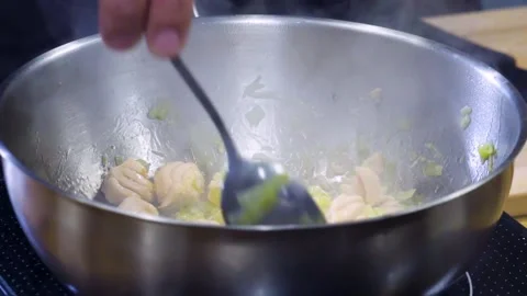 Cooking salmon fish and leek sauce in a pan. Salmon and broccoli sauce. Video stock 150590573