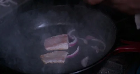 Cooking salmon in a pan in slow motion 1 Stock Footage 87846084