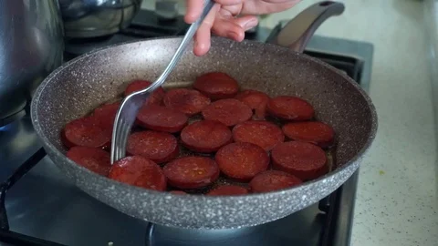 Cooking sausage in a pan, Stock Footage 110686683