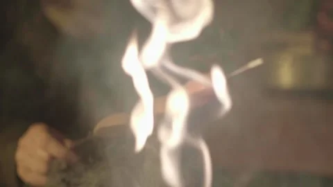 Cooking sausages at camp fire 스톡 동영상 141079110