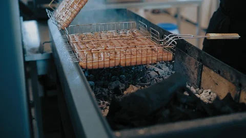 Cooking Sausages on the Chafing Dish in the Park Stock Footage 112675813
