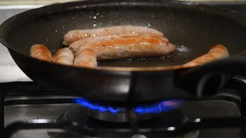 Cooking sausages. 스톡 동영상 100155154