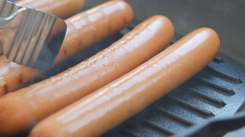 Cooking sausages on the grill Stock Footage 70414324