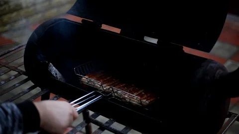Cooking sausages in the grill. Stock Footage 129840405