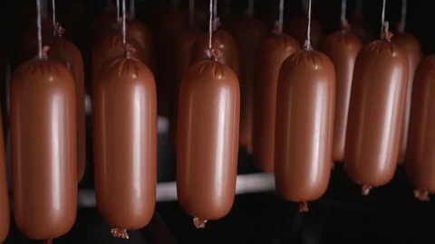 Cooking sausages in a multi-colored shell Stock Footage 118274779