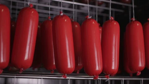 Cooking sausages in a multi-colored shell Stock Footage 118274781