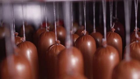 Cooking sausages in a multi-colored shell Stock Footage 118274878