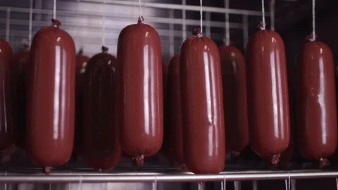 Cooking sausages in a multi-colored shell Stock Footage 118274879