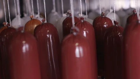 Cooking sausages in a multi-colored shell Stock Footage 118274908