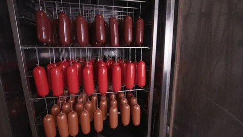 Cooking sausages in a multi-colored shell Stock Footage 118275417
