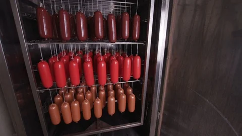 Cooking sausages in a multi-colored shell Stock Footage 118275419