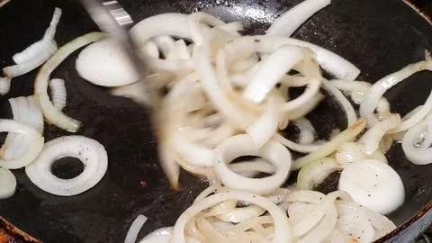 Cooking saute onions in a pan Stock-Footage 111311953