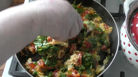 Cooking scrambled eggs with vegetables. healthy food concept Stock Footage 161242476
