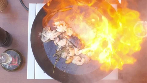 Cooking seafood in pan with flame 스톡 동영상 74939716