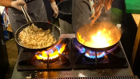 Cooking Seafood In Pan With Flame Stock Footage 121838318