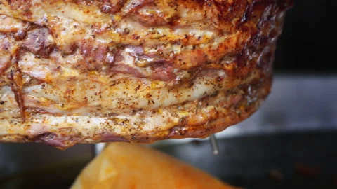 Cooking shawarma, meat layers strung on a skewer Video stock 145238728