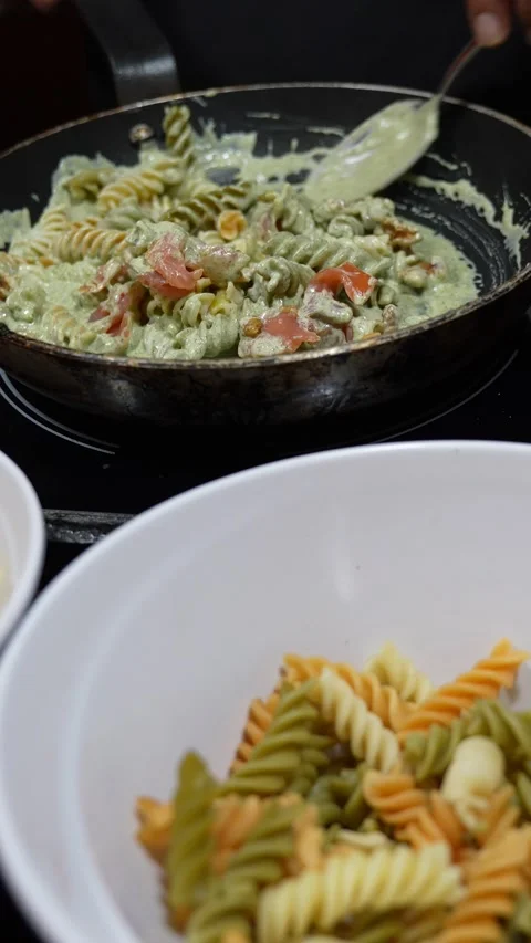 Cooking show: Chef Preparing Pesto Pasta with Salmon and Parmesan Stock Footage 342266245