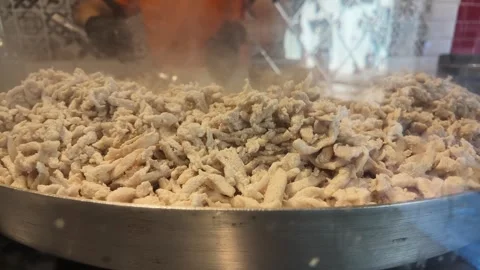 Cooking shredded meat in a kitchen setting Stock Footage 344724289