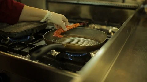 Cooking shrimps in a pan Stock Footage 88439435