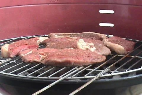 Cooking Sirloin Steaks On BBQ Stock Footage