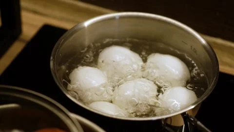 Cooking Six Eggs in Boiling Water on a Stovetop for a Perfect Breakfast or Snack 스톡 동영상 314727744