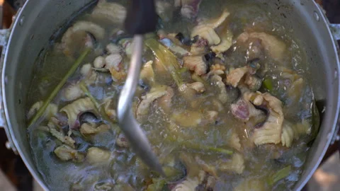 Cooking slice fish in boiling pot, soup fish delicious prepared, top view  Video stock 145840381