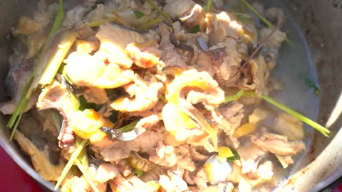 Cooking slice fish in boiling pot, soup fish delicious prepared, top view  Stock Footage 145840398