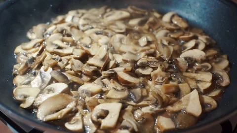 Cooking Sliced Mushrooms Stock Footage 87330746