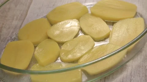 COOKING Sliced ​​Potatoes Stock Footage 155653347