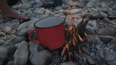 Cooking on small campfire Stockbeeldmateriaal 90039303