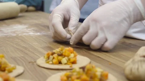 Cooking small pies with pumpkin Video stock 69993833