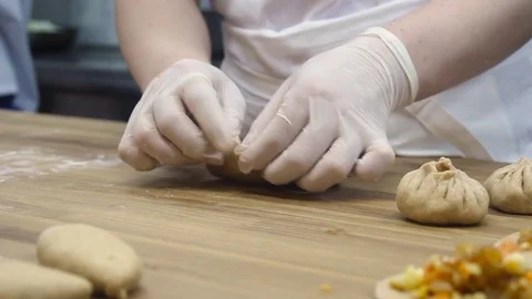 Cooking small pies with pumpkin Stock Footage 70004171