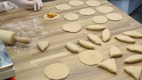 Cooking small pies with pumpkin Video stock 70004175