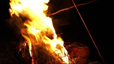 Cooking soup in a cauldron on an open fire Stock Footage 99051789